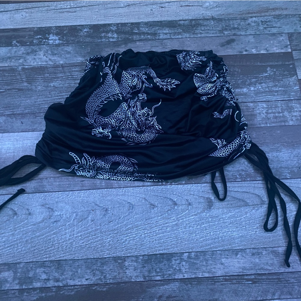 Black with white dragon design, fitted mini skirt, size small